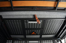 Alu-Cab under-bed Molle panel fitted under the bed section with light and Alu-Cab logo