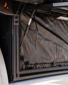 Alu-Cab side door mozzie/midge net zipped closed in a mid-size side door opening