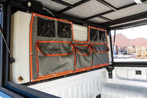 Alu-Cab water tank canvas bag kit fitted on the water tank, mesh pockets and zipped pouches