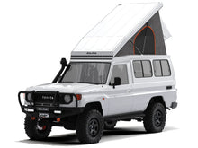 Alu-Cab Hercules roof conversion, white, open on a Toyota Land Cruiser 78 Troopy