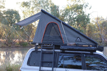 Alu-Cab LT-50 tent with fly sheet on a Land Cruiser by the river