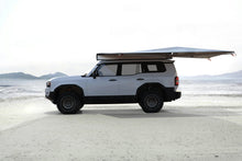 Alu-Cab 270 Shadow Awning 2.5m open on a Land Cruiser Prado 250 on a salt pan
