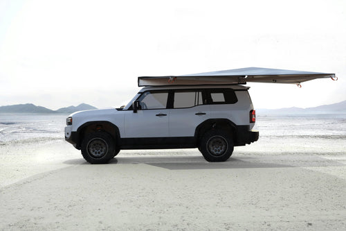 Alu-Cab 270 Shadow Awning 2.5m open on a Land Cruiser Prado 250 on a salt pan