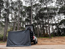 Alu-Cab Universal Side Panel hanging from a Shadow Awning