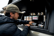 Alu-Cab kitted kitchen cupboard in use inside a canopy side door