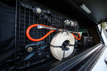 Alu-Cab recovery kitting in a canopy cupboard holding kinetic rope, hose and shackles