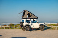 Alu-Cab LT-50 tent with fly sheet on a Suzuki Jimny at the beach