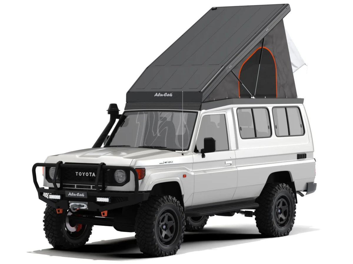 Alu-Cab Hercules roof conversion, black, open on a Toyota Land Cruiser 78 Troopy