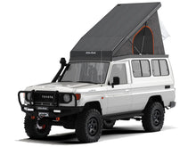 Alu-Cab Hercules roof conversion, black, open on a Toyota Land Cruiser 78 Troopy