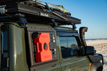 Alu-Cab Jimny 5L red fuel jerry can on the molle plate of a green Jimny