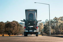 Canopy Camper rear view with full vertical rear door open