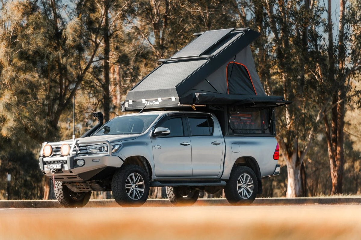 Alu-Cab Canopy Camper on a Toyota Hilux double cab: the camper this fit kit mounts, not the fit kit itself