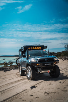Toyota Hilux with Alu-Cab ModCAP 4-sleeper Family Camper Tent