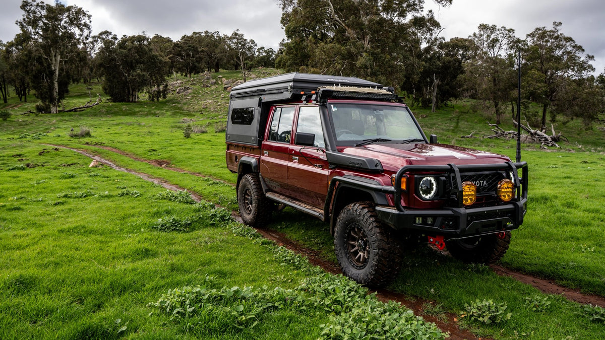Toyota Land Cruiser 79 double cab with Alu-Cab ModCAP and 4-sleeper Family Camper Tent