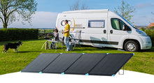 Renogy 400W Lightweight Portable Solar Panel Suitcase — deployed beside a motorhome