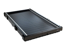Front Runner Cargo Bed Slide, Large, extended in a vehicle load bed, photo 2