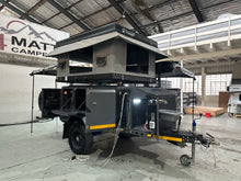 Metalian Maxi with the BunduTop rooftop tent opened and the awning extended