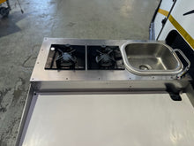 2026 Nayela Mahem demo – outside kitchen with two-burner gas stove and stainless basin