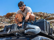 Ratcheting shovel mount on a roof rack