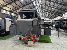 Silverback Lunar off-road camper, front three-quarter view with a canvas drop side down
