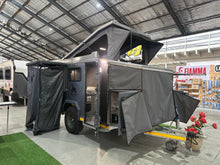 Silverback Lunar off-road camper, three-quarter view with the canvas drop side and door open
