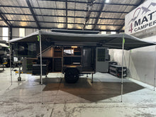 2025 Tuff Cats Shumba Elite 2 – side view in camp mode with the roof raised, awning out and kitchen lockers open