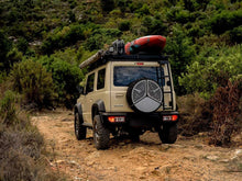 Front Runner spare tyre braai in use at camp